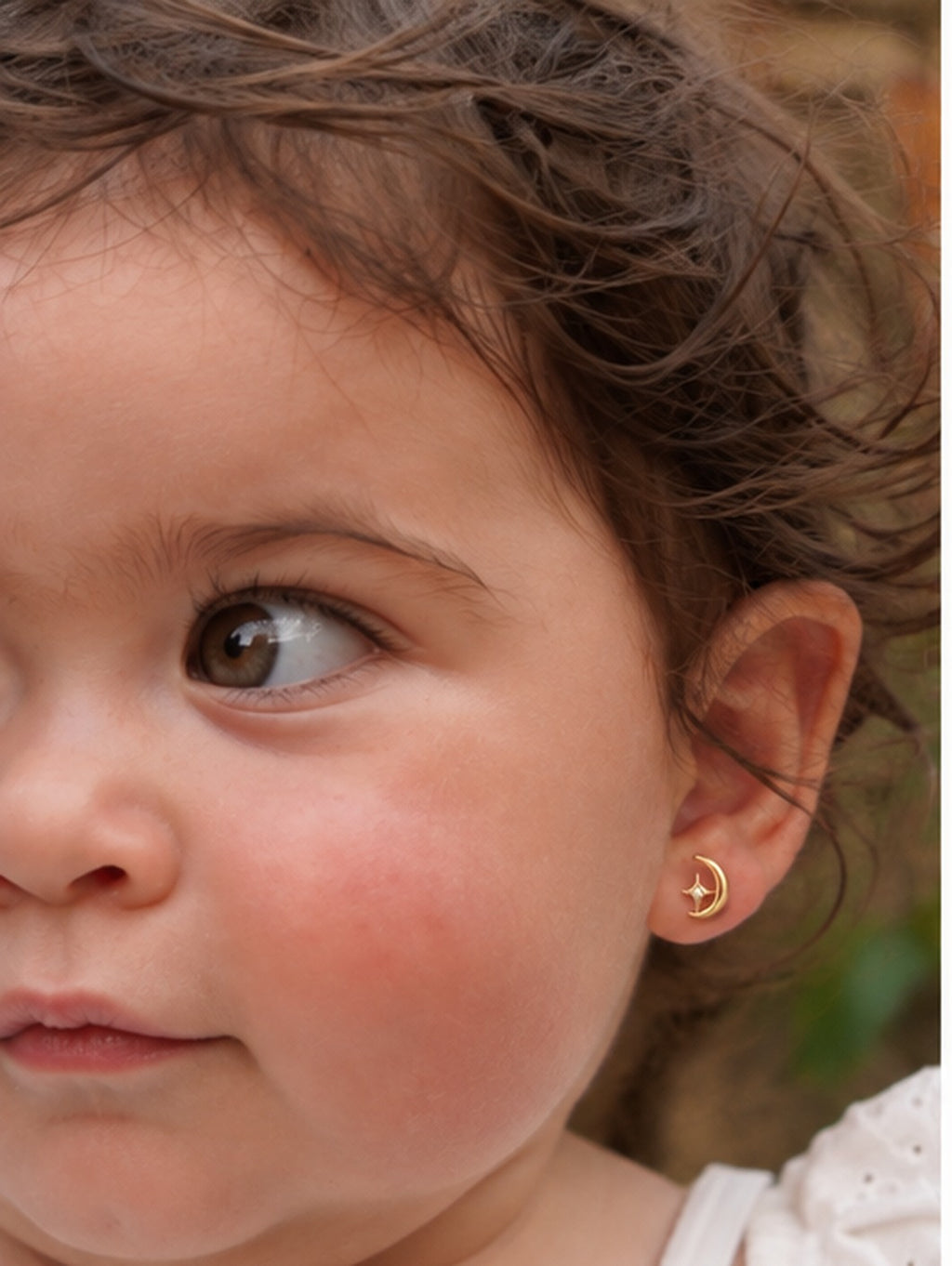 Amara wearing the Moon & Star Studs