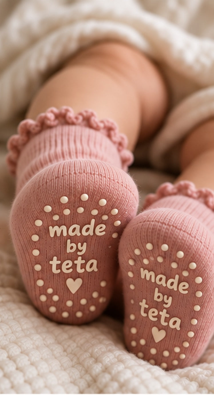 Baby wearing the pink socks