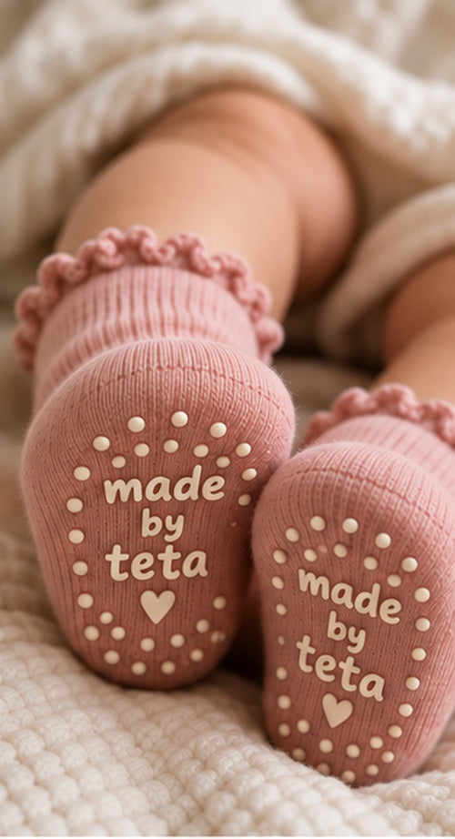 Baby wearing the pink socks